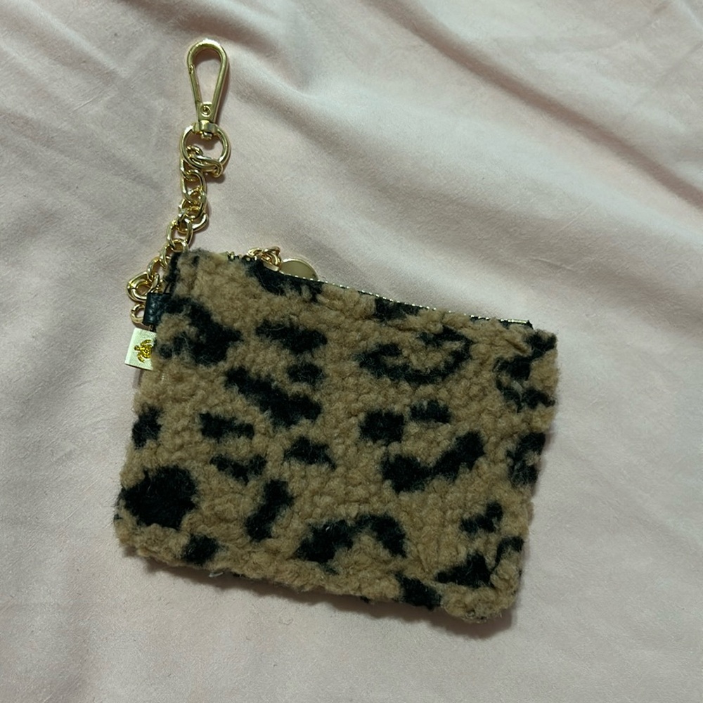 Fuzzy cheetah print wallet. Simply southern. Never used.